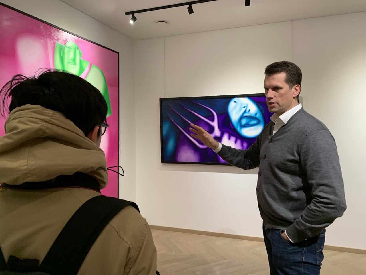 Dr. Laurynas Jonušauskas in conversation in front of Walk at the Arty Cube gallery, Vilnius